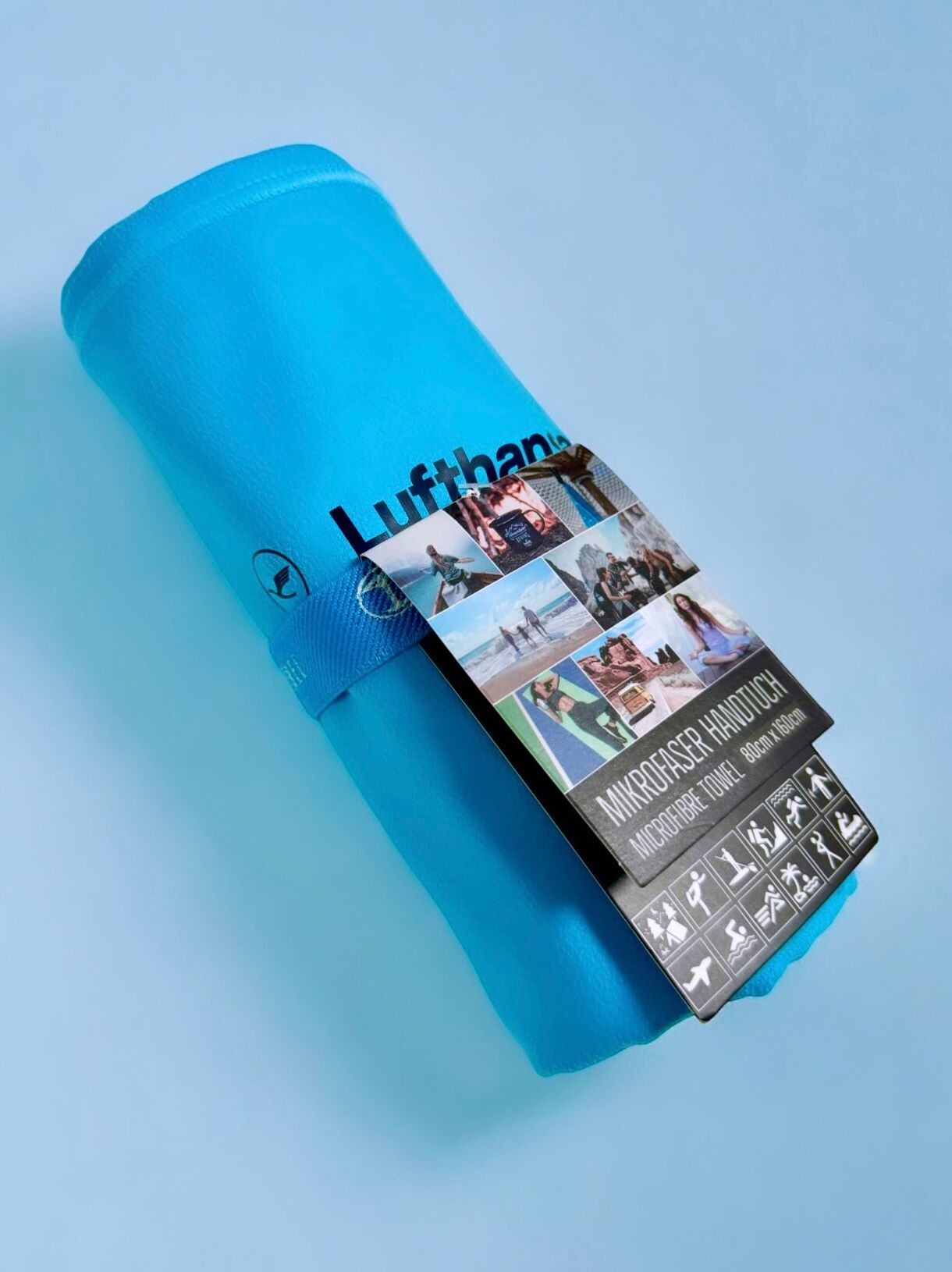 Handtuch mit Sonderfarbe und Logoprägung – individuell gefertigt für Unternehmen Mikrofaserhandtuch in individueller Sonderfarbe mit Logo für Markenprojekte